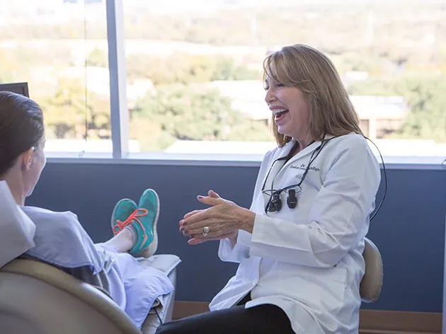 Dr. Swift at the office with patient