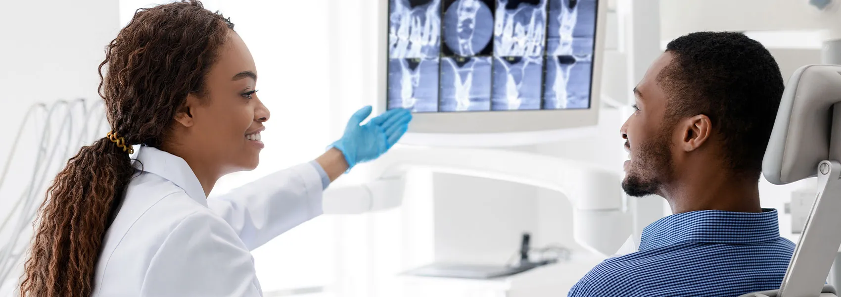 Dentist explaining the treatment to her patient