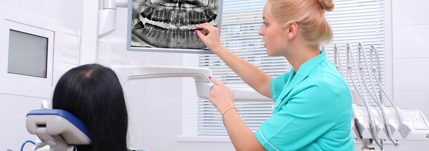 Dentist explaining about dental crown to her patient