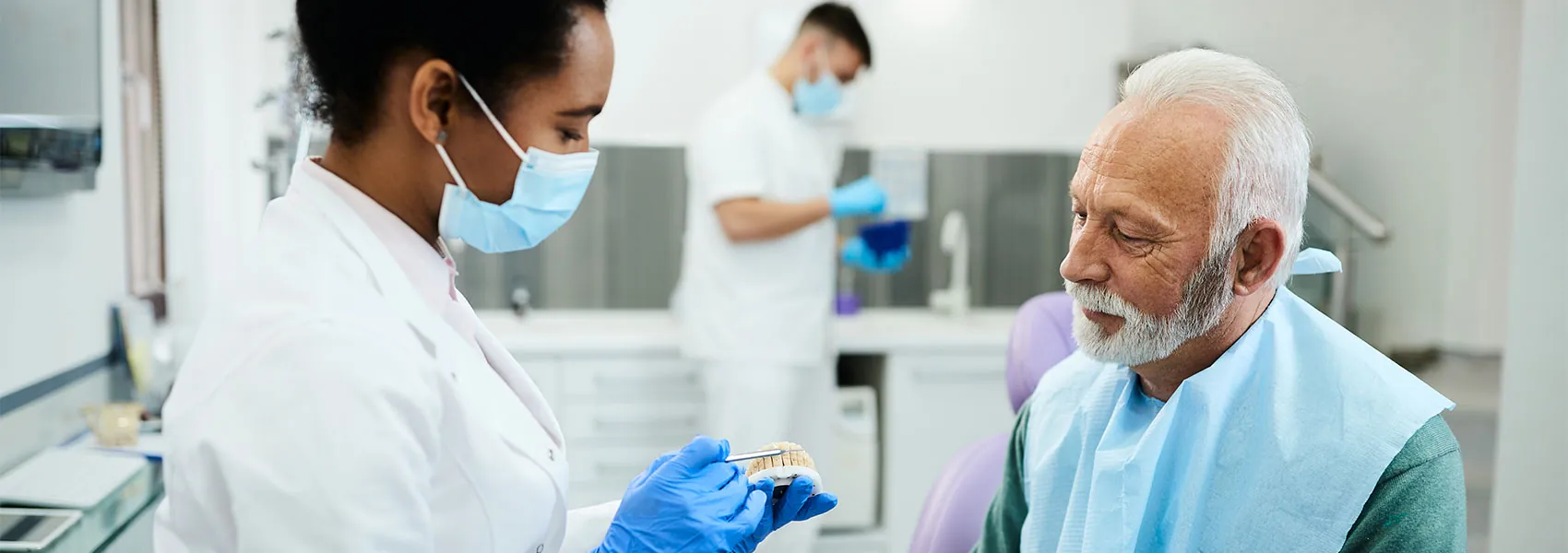 Dentist explaining about the dentures
