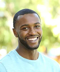 Man smiling at outside