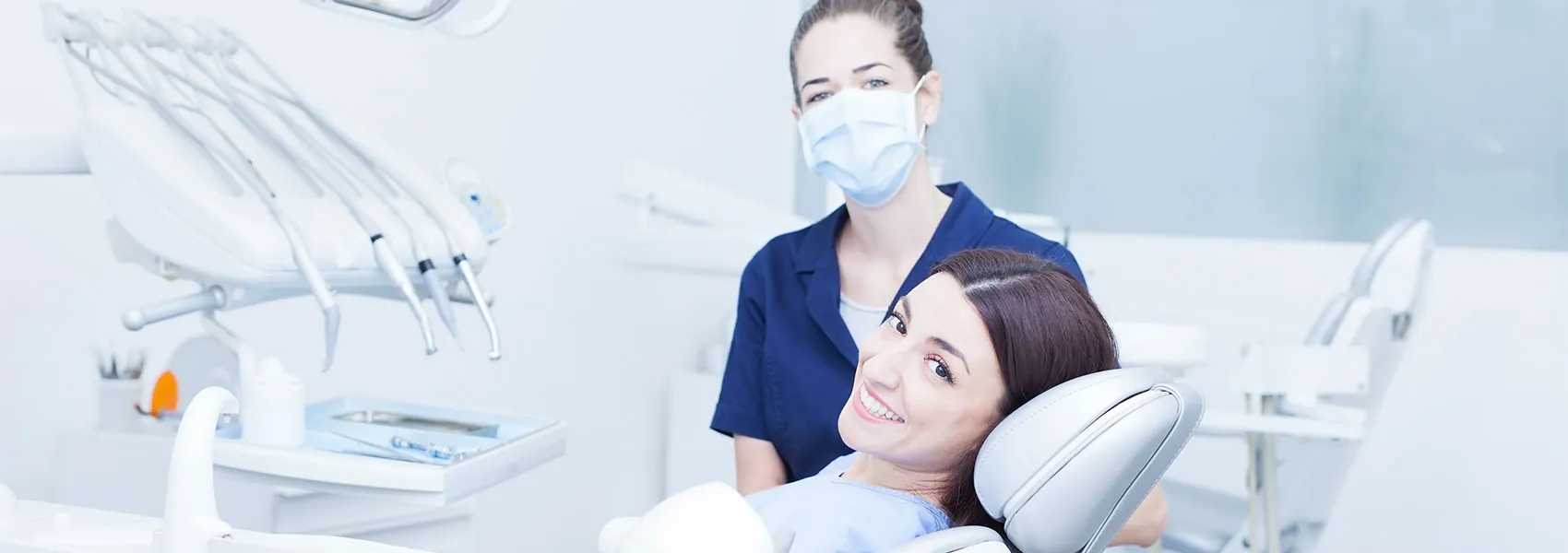 Dentist and patient smiling