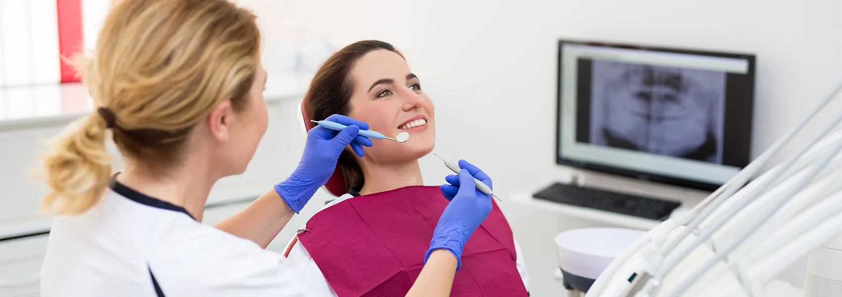 Dentist doing treatment to her patient