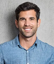 Smart young man smiling