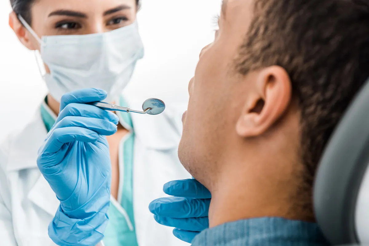Dentist doing dental checkup for her patient