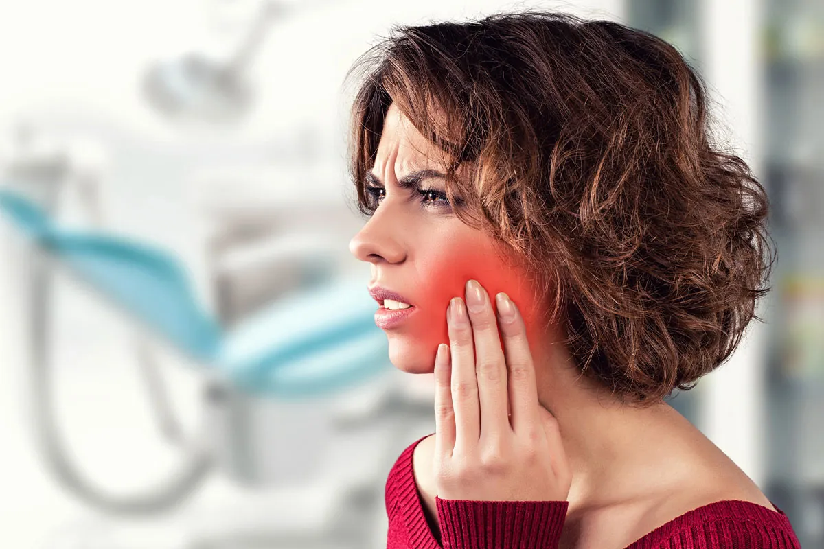 Woman in tooth pain