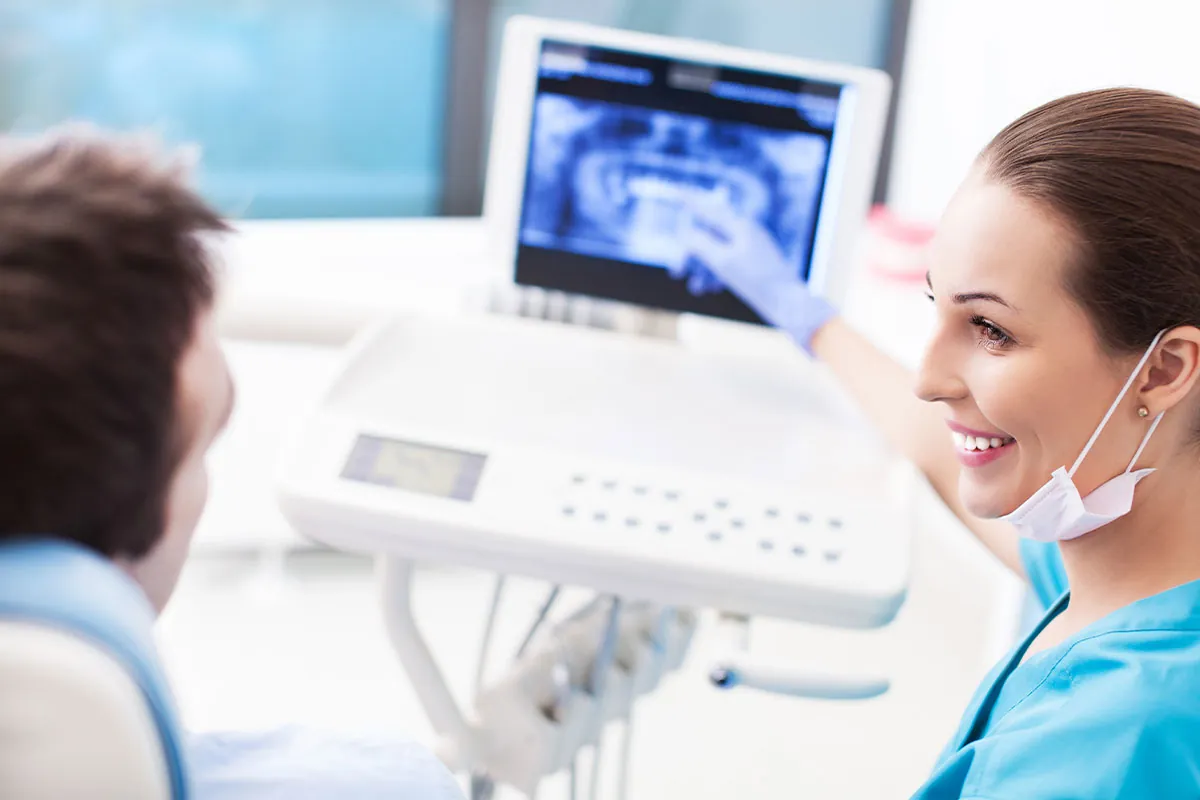 Dentist taking a x-ray from patient's teeth