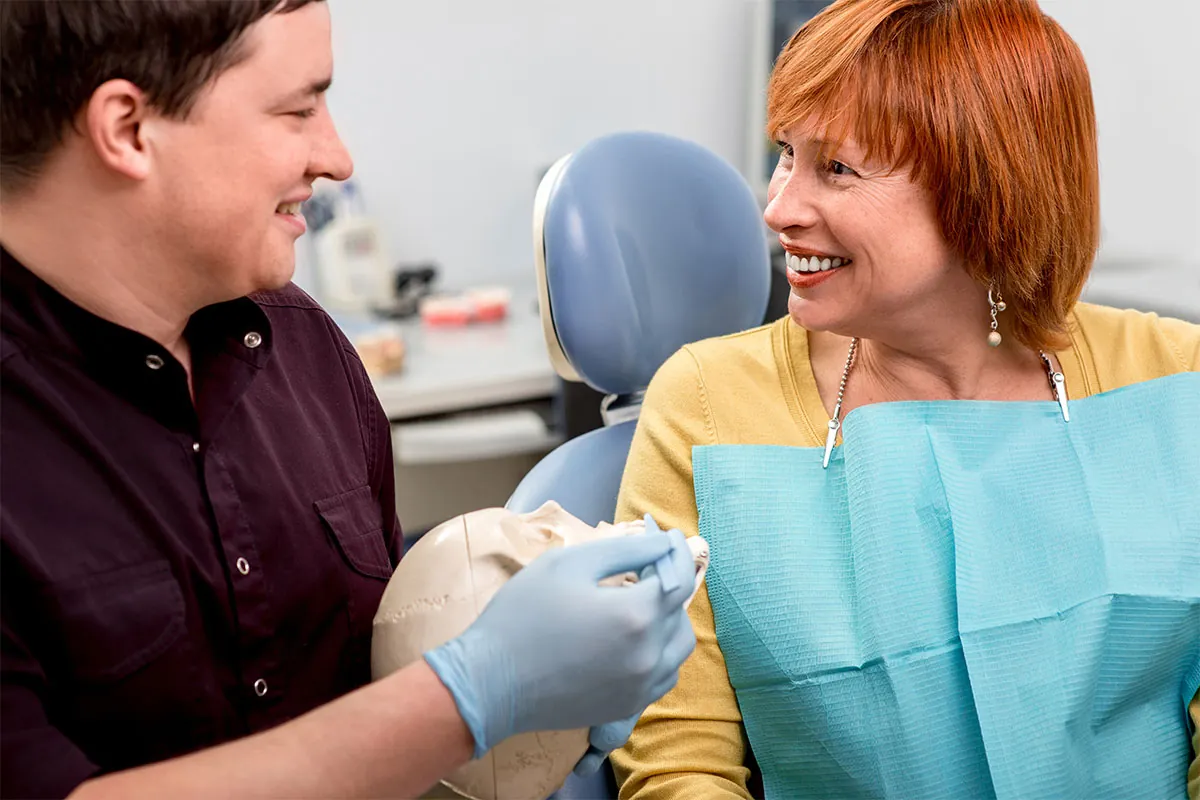 Dentist talking with patient