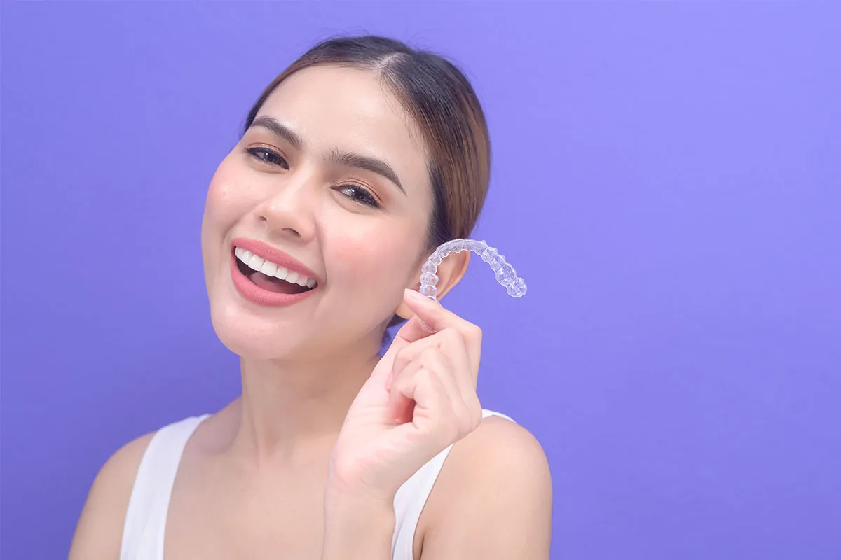 Beautiful girl smiling with Invisalign
