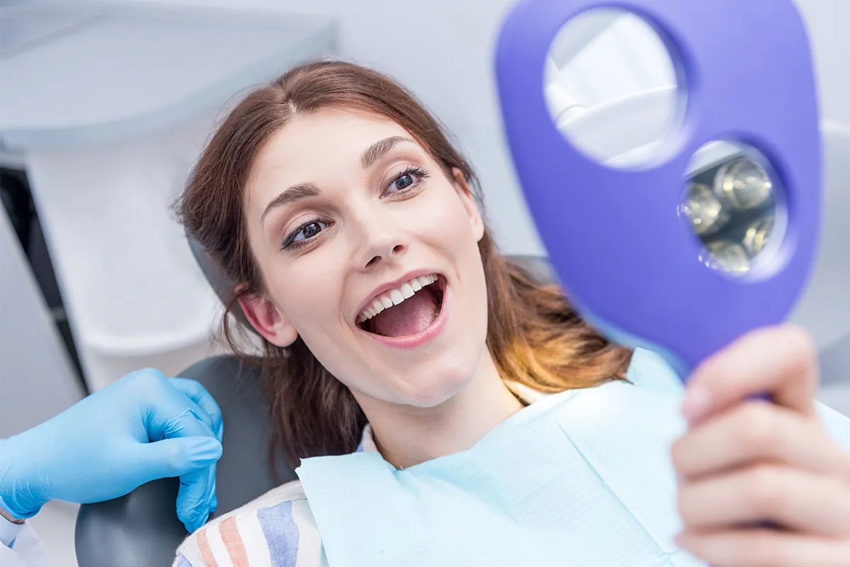 Patient checking her teeth